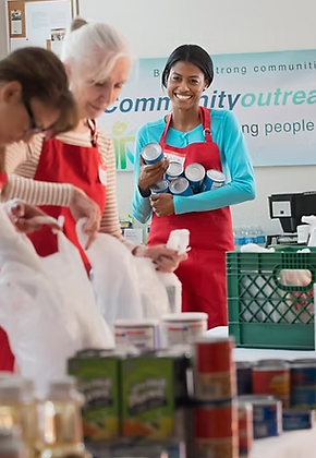 Image of volunteers working at a community food drive