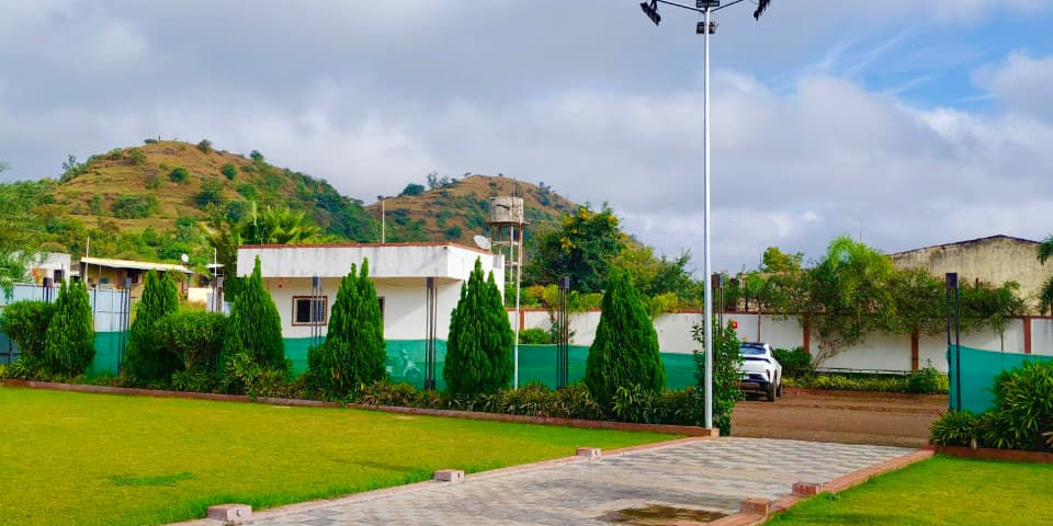 Wide angle view of lush green lawns with colorful flowers