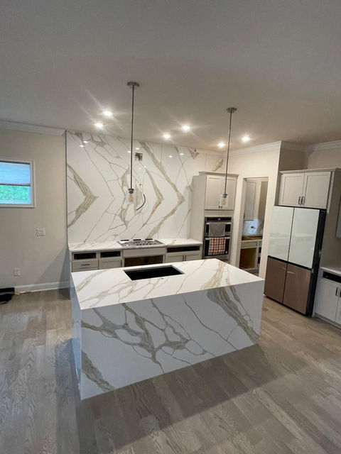 Modern Kitchen with Quartz countertops and island quartz waterfall