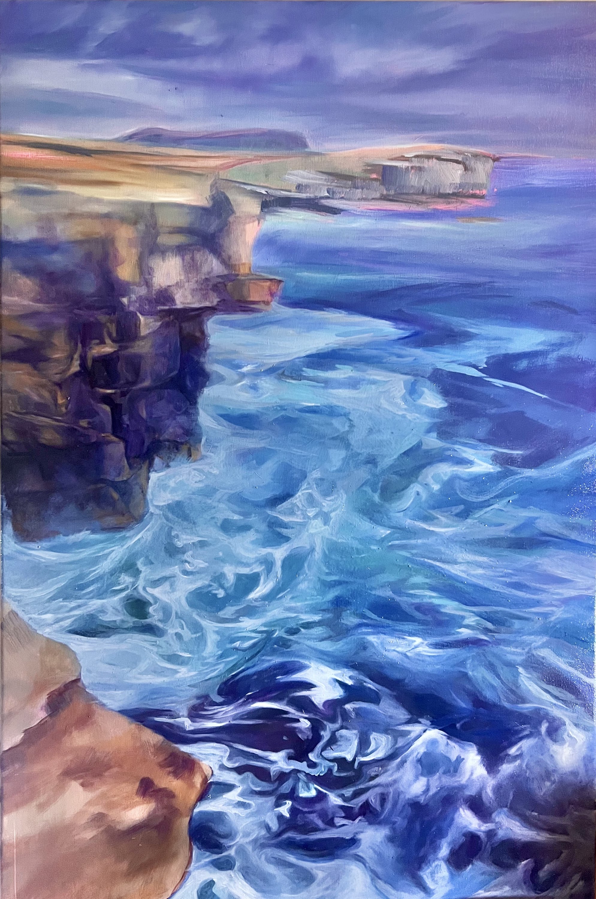 Blue-violet cliffs above rolling sea, looking towards Hoy