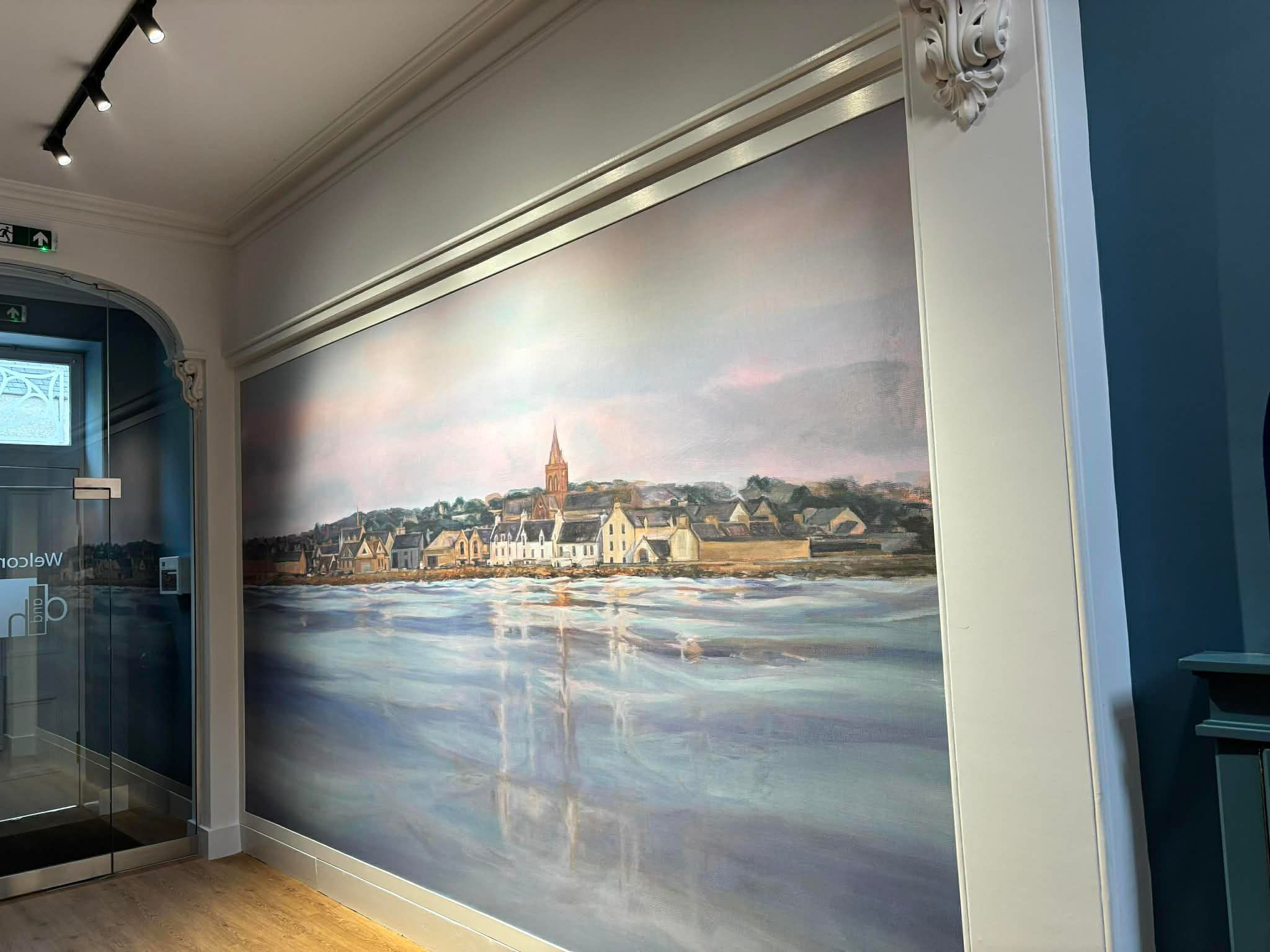 Jennifer Austin’s Orcadian waterfront mural installed in the entrance to D & H Law’s Kirkwall offices, framed by original architectural mouldings