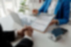 Insurance agent and client reviewing home insurance options in Florida, engaged in a detailed discussion.