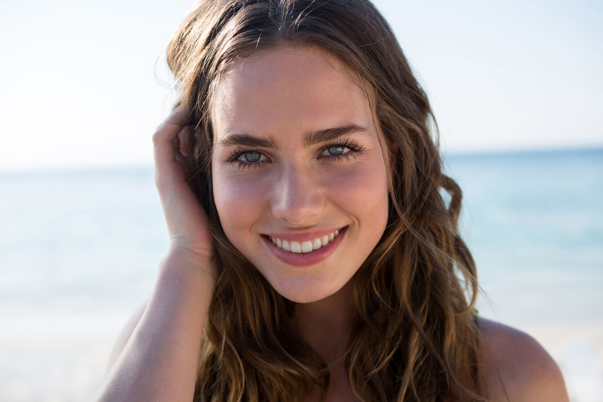 8_portrait-of-smiling-beautiful-woman-at-beach-2021-08-28-17-20-01-utc.jpg
