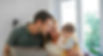 Mom and Dad looking at baby