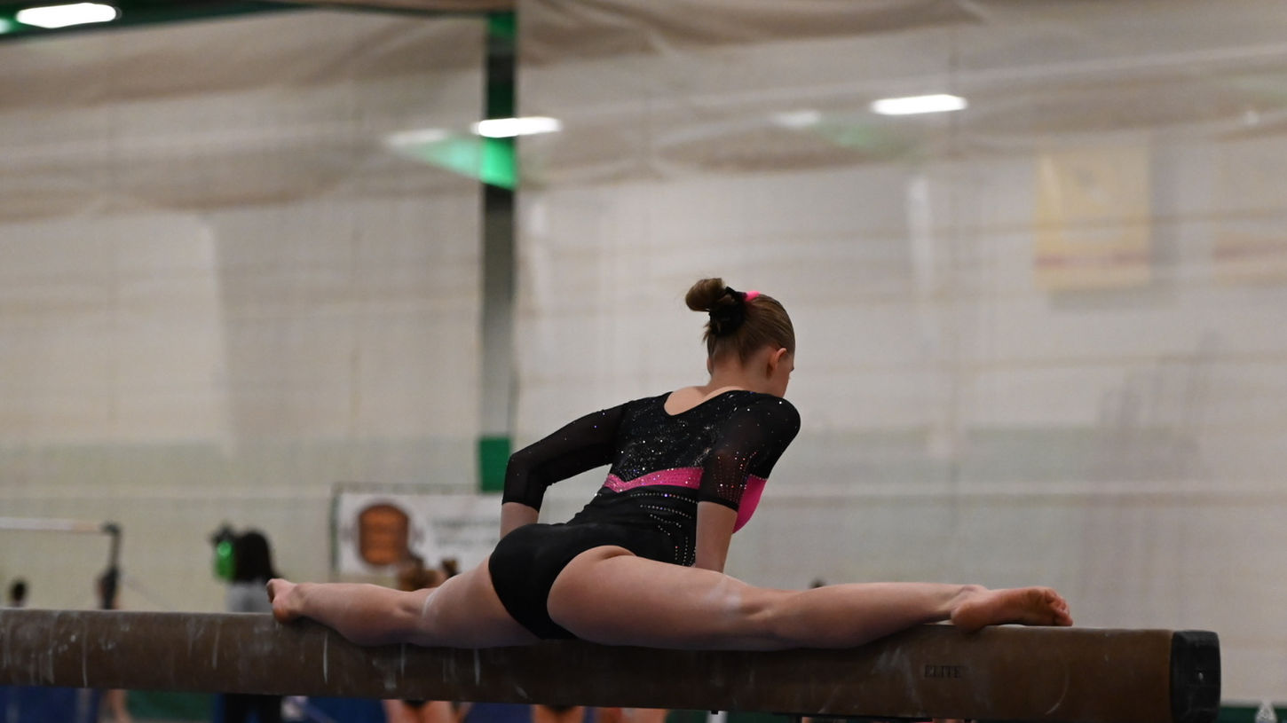 VIGS competitive gymnast on beam