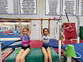Gymnasts on bar