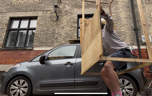 Solo lift onto car. This is why I haven't fully constructed it on land - I have to be able to lift it onto the rack. The chipboard/OSB is posittioned as a plate in the centre of the cubicle to sit on the car rack. 