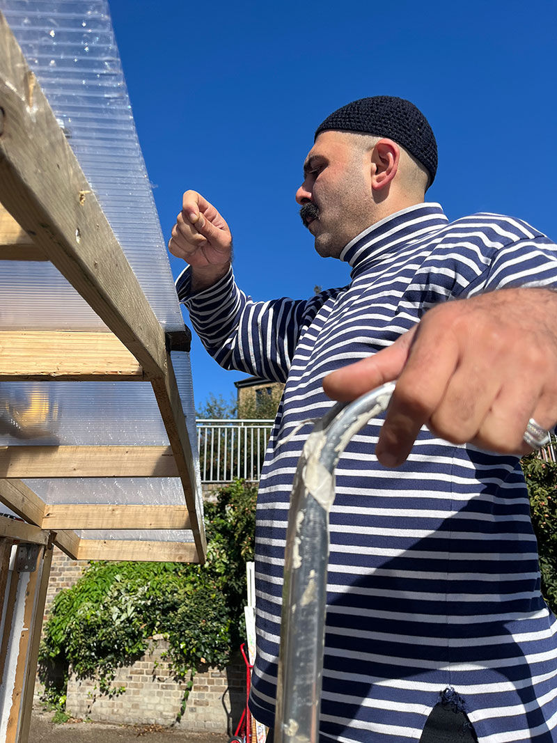 Peeling of protective plastic film from polycarbonate. Suitable attire.