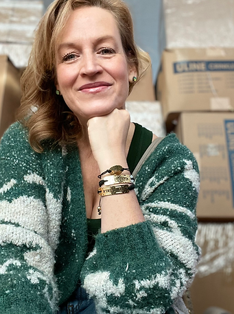Chrisie Canny in a U-Haul rental truck surrounded by boxes taken on her way to the fulfillment center for when she was on TV