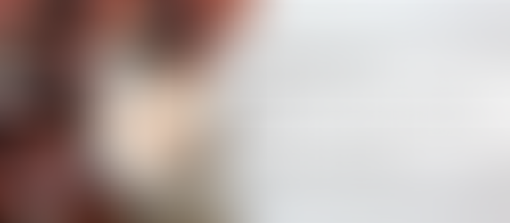 Hormone-healing pumpkin latte in ceramic mug with cinnamon dust, soft fall light