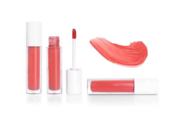Coral lip gloss tubes and applicator with a coral brushstroke swatch on a white background.