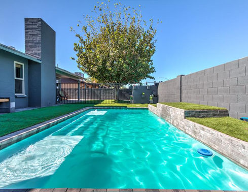 Broadway compact fiberglass pool with clean waterline and narrow backyard footprint