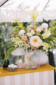yellow and white flowers for an event at the wayback