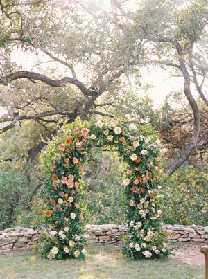 Flower Arch covered in greenery and roses at The Wayback in Austin, Texas the best Austin Texas Wedding Venue