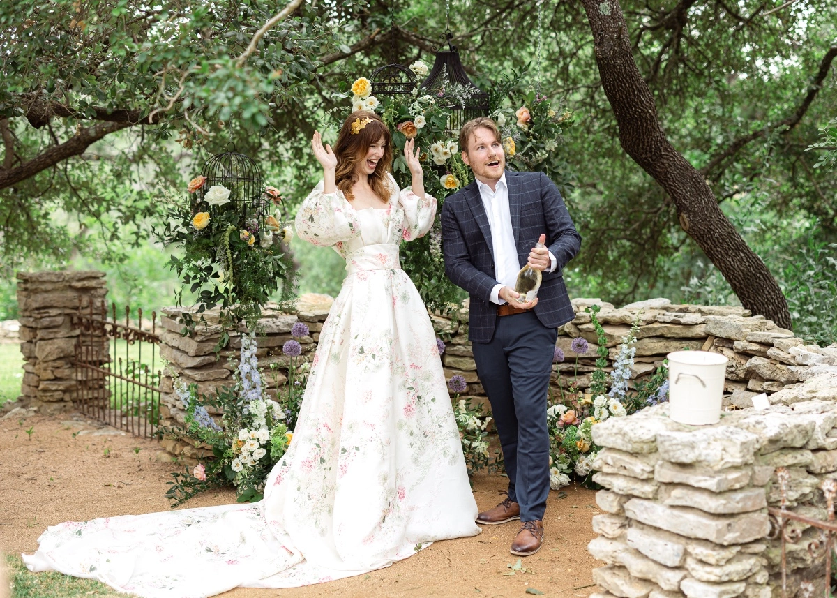 Bridal model surrounded by florals in a Monique Lhuillier dress surprise proposal at The Wayback in Austin Texas 