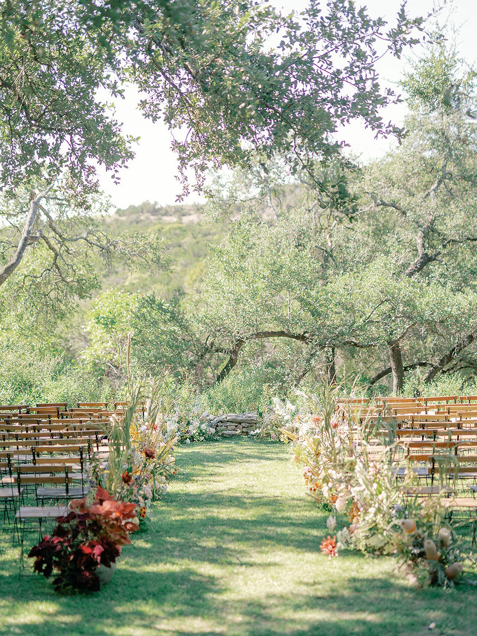 wedding ceremony set up with lush florals at the wayback in austin texas