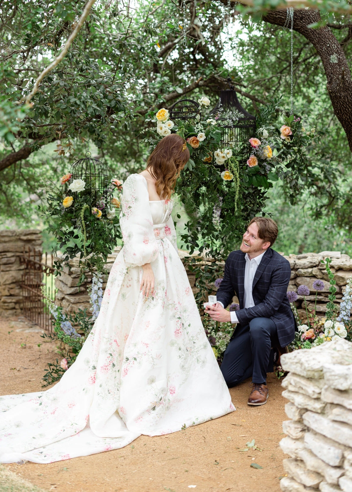 Bridal model surrounded by florals in a Monique Lhuillier dress surprise proposal at The Wayback in Austin Texas 