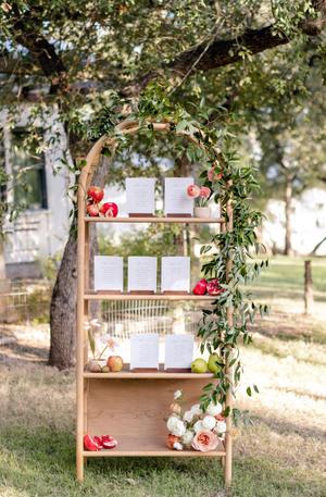 Table seating chart with florals and fruit for a wedding at The Wayback in Austin Texas