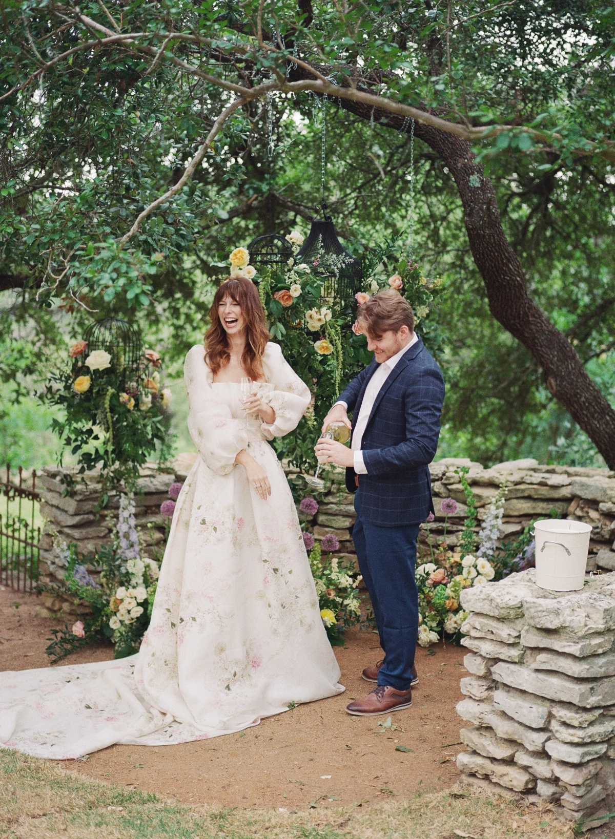Bridal model surrounded by florals in a Monique Lhuillier dress surprise proposal at The Wayback in Austin Texas 