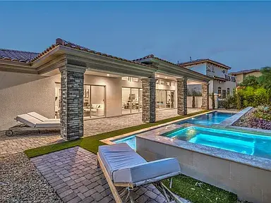 Outdoor living area with pool in The Allegra floorplan from the SouthShore Collection by Trust Home Builders at Lake Las Vegas, Henderson, Nevada
