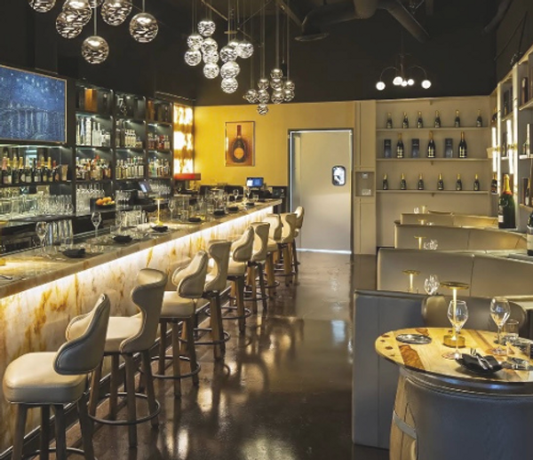 Renovated upscale bar interior completed by Trust Commercial Builders NV.