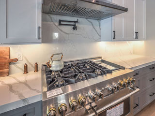 The Allegra by Trust Home Builders: range and backsplash