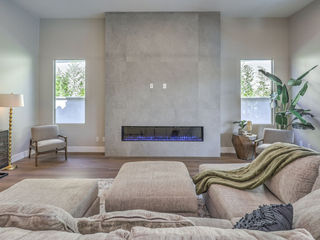 The Allegra by Trust Home Builders: fireplace and living area