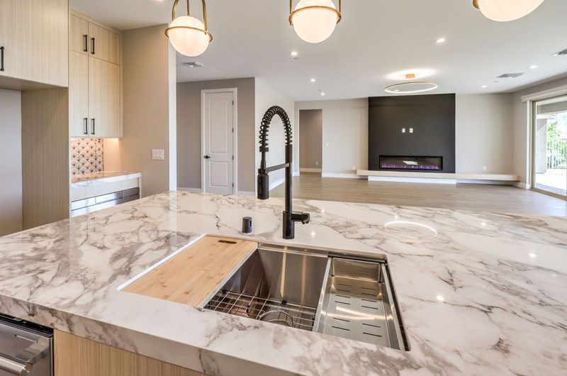 Kitchen island detail with integrated sink in a custom home by Trust Home Builders in Northwest Las Vegas, Nevada