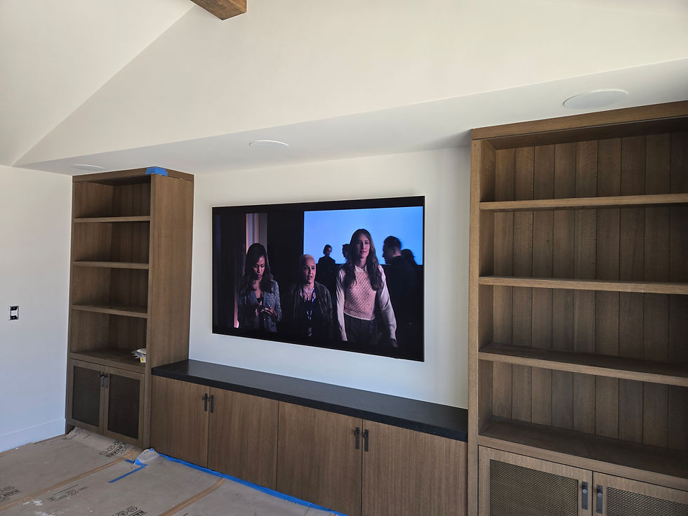 Motorized TV lift with Apple TV and Sonos integration in custom home