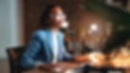 Woman, computer and smile in office at night with decision, proposal or review at investme