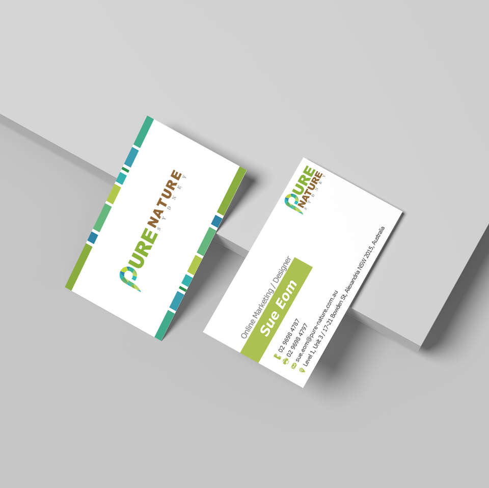 Two business cards overlapping on a minimalist grey background, designed for a brand named Pure Nature Sydney. The design features a fresh green and teal color palette with a clean layout displaying contact information for an online marketing designer named Sue Eom. Designed by Studio Sue.