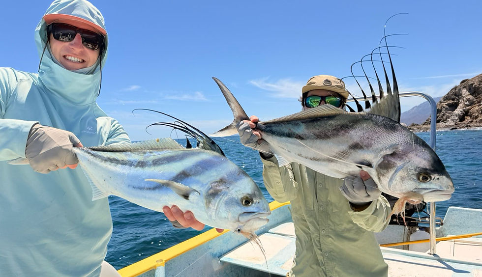 Two anglers holding roosterfish