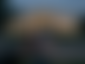 Smartphone screen showing a viral breaking-news post against a blurred White House background, illustrating the rapid spread of the Trump nuclear codes claim across social media.