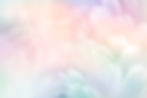 Abstract feather rainbow patchwork background Closeup image of white fluffy feather under