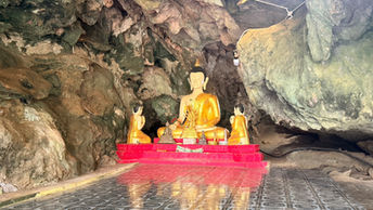 Buddha shrine inside a limestone cave in Khao Sok