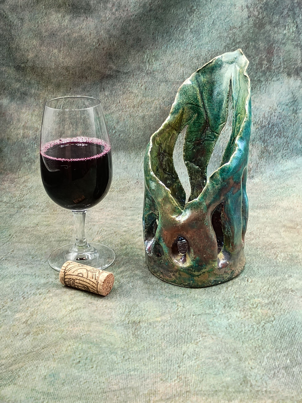 Raku Tealight or or Candle Holder from the Raku collection with wine glass and cork.