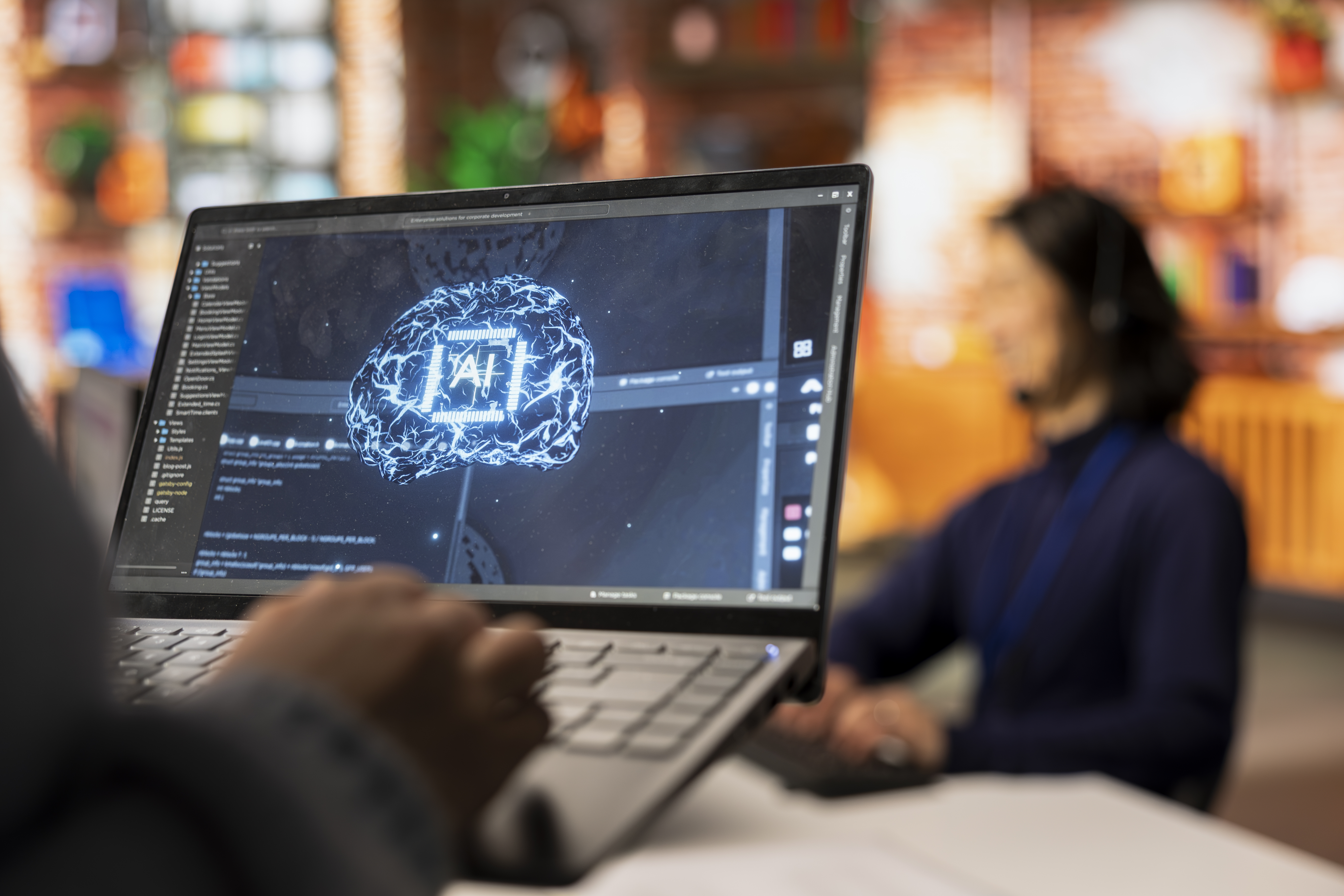 call-center-worker-using-ai-tech-laptop-reply-customers-closeup.jpg