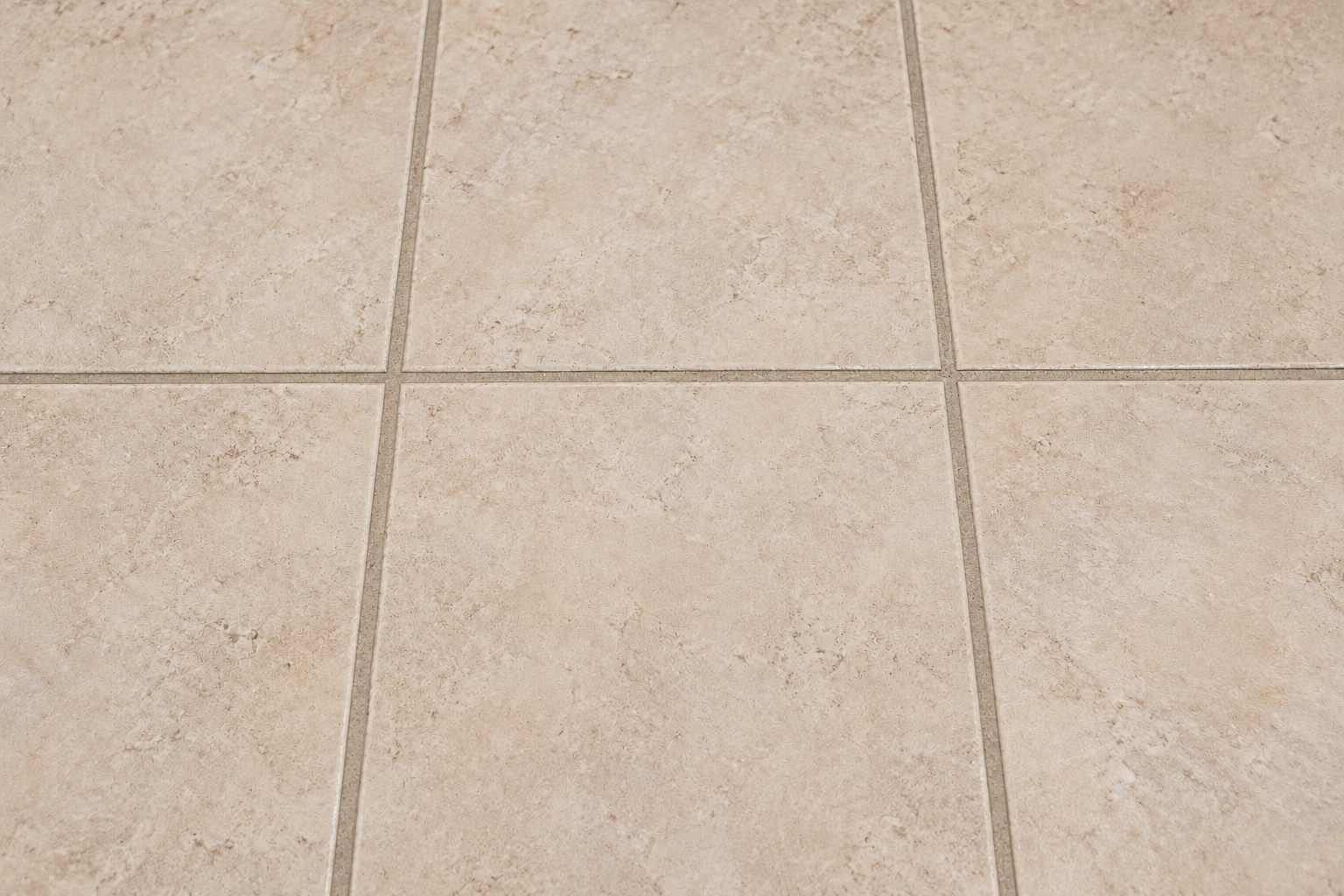 The same illustrative tile floor with clean grout and a refreshed surface.
