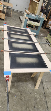 Island panel in assembly clamps