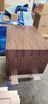 Walnut range hood with continuous grain pattern
