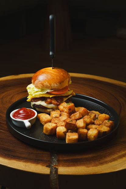 A stacked burger and crispy bites, made for sharing.
