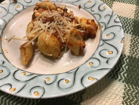 Meaty Pork and Beef Bolognese with pasta shells, fresh herbs and three cheeses.
