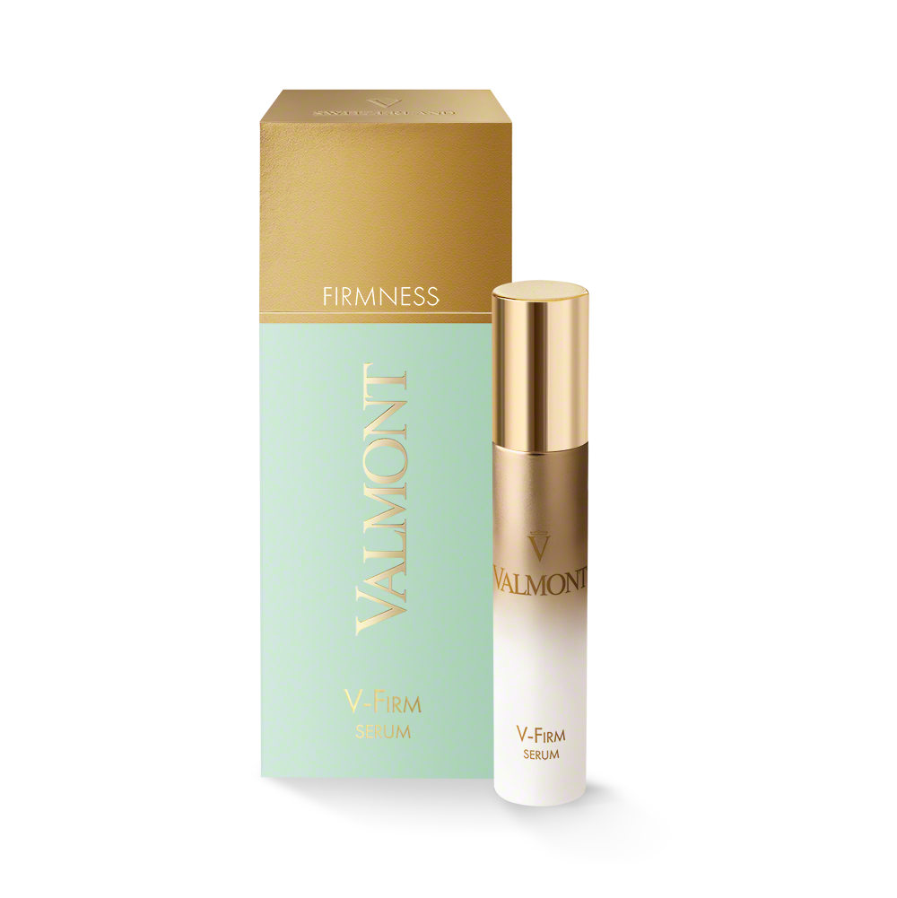 V-Firm Serum bottle standing next to Valmont packaging box