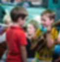 Children playing a Ukelele_edited_edited.jpg