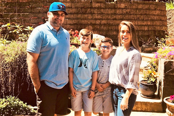 Brandon and Family at the house.jpeg