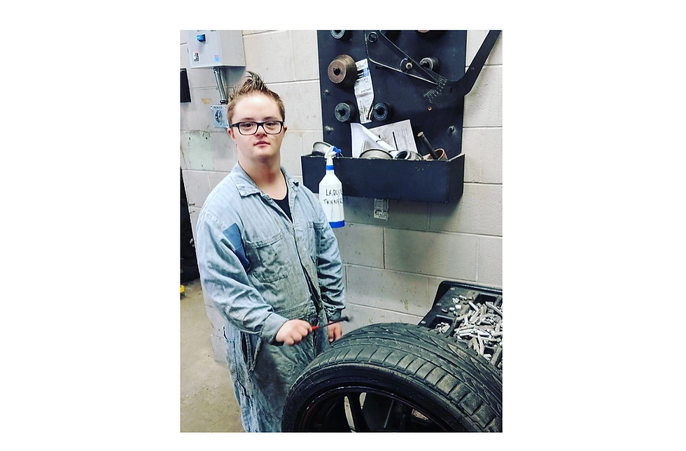 boy with down syndrome in coveralls