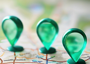 blurred map with 3 aqua green location pins.jpg
