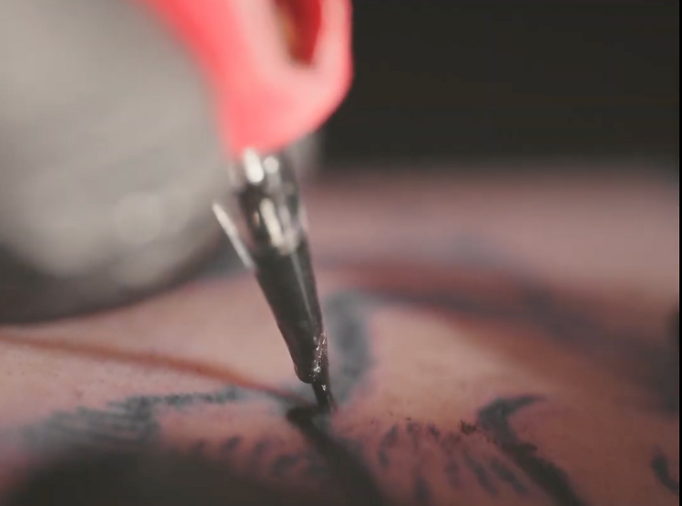 Close up on tattoo needle touching skin in Ikigai Tattoo Studio Johannesburg