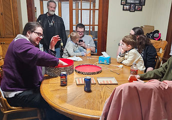 Picture of some of my kids and grandkids playing a trivia game on Christmas eve.
