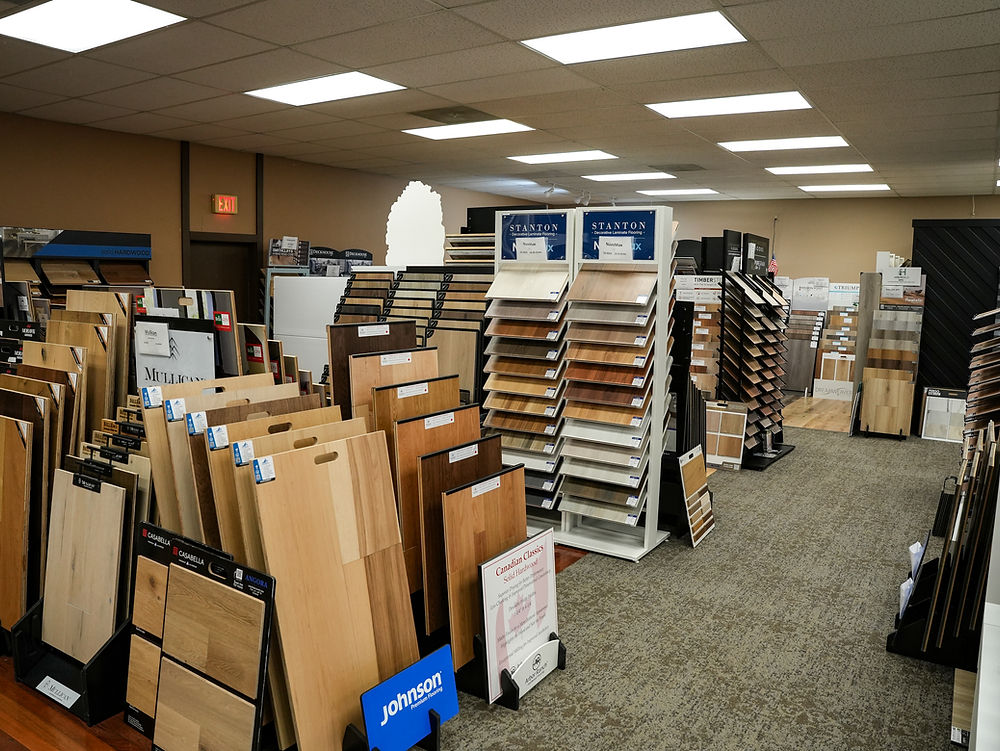 Flooring showroom with hardwood, laminate, and vinyl flooring samples